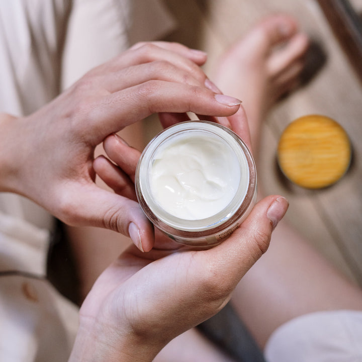 Topical cannabinoid cream lifestyle shot top down showing product texture